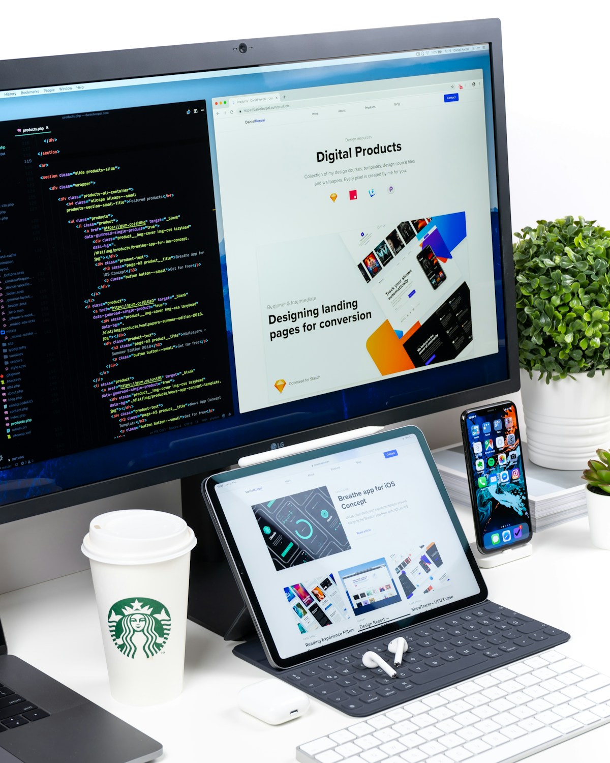 A web design workspace with a desktop monitor, tablet, and phone showing page layouts